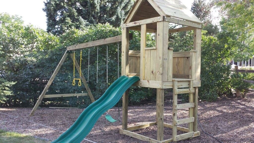 4'x4' Clubhouse with wooden roof, 4' Deck height, Standard slide, Ladder entry, 12' Swing beam with 2 Standard swings & Trapeze bar