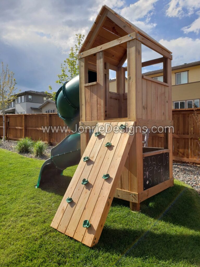 5'x5' Clubhouse with wooden roof, 4' Deck height, 5' Enclosed spiral slide, Rock wall entry, Enclosed bottom & Chalk board