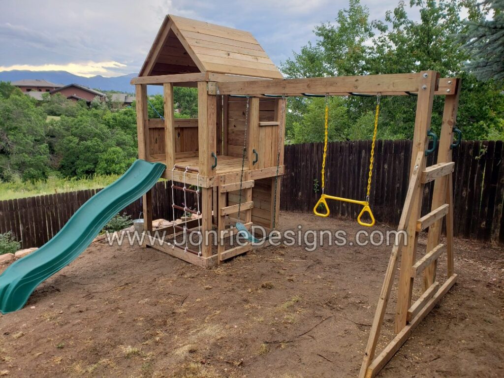 5'x5' Clubhouse with wooden roof, 4' Deck height, Upgraded slide, 2' Cargo net, 8' Climbing wall, 8' Monkey bars with Standard slide, Trapeze bar & Bucket drop