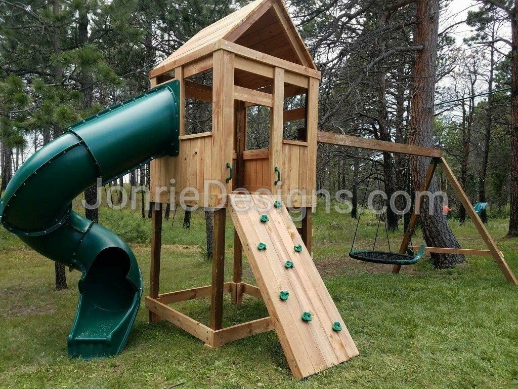 5'x5' Clubhouse with wooden roof, 5' Deck height, 7' Enclosed spiral slide, Ladder entry, Rock wall entry, 8' Swing beam with Standard swing & Web swing