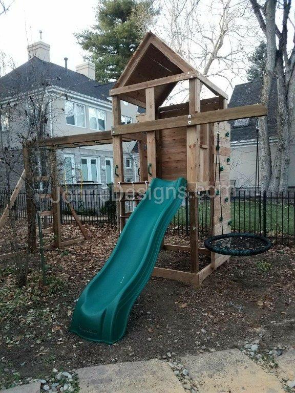 5'x5' Clubhouse with wooden roof, Enclosed back wall, 5' Deck height, 5' Standard slide, 2' Cargo net, 8' Climbing wall, 8' Monkey bars with dual ladders, Trapeze bar, 3' Cantilever with Web swing