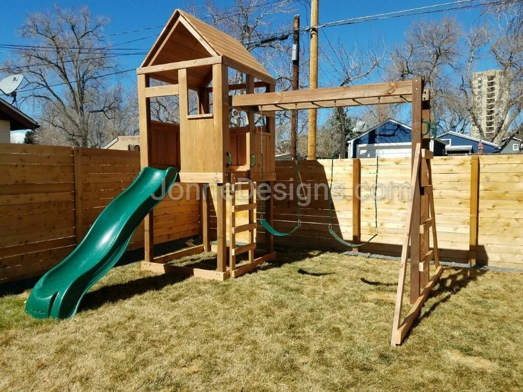 5'x5' Clubhouse with wooden roof, 5' Deck height, 5' Standard slide, 8' Monkey bars with dual ladders & 2 Standard swings