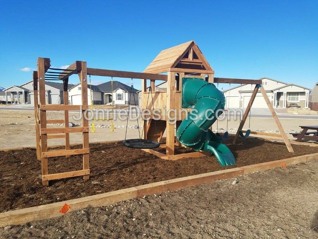 5'x5' Clubhouse with wooden roof, Rock wall entry, 5' Enclosed spiral slide, 2-8' Swing beams, 8' Monkey bars with dual ladders, 2 Standard swings, Trapeze bar & Web swing