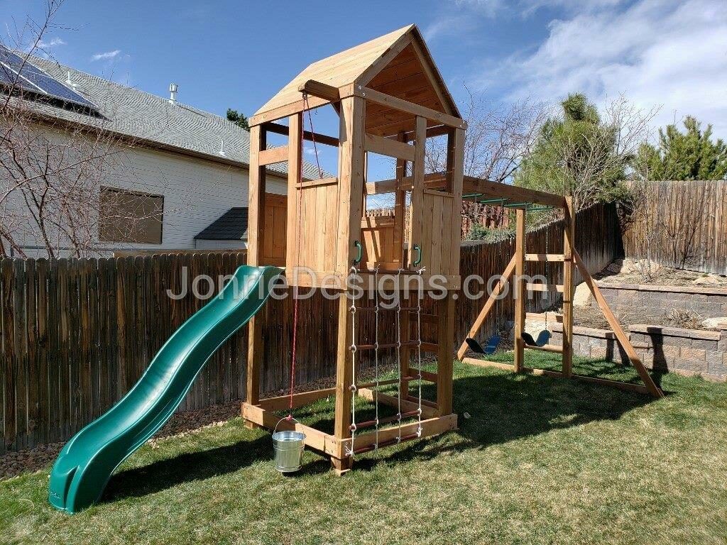 5'x5' Clubhouse with wooden roof, 5' Deck height, 5' Standard slide, 3' Cargo net, Drop down bucket, 8' Monkey bars with dual ladders & 2 Standard swings