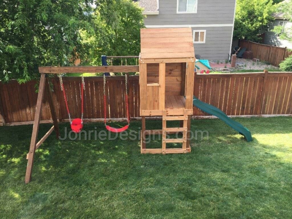4'x4' Clubhouse with wooden roof, 4' deck, 4' Standard slide, Ladder entry, Red standard swing & Red Bucket swing