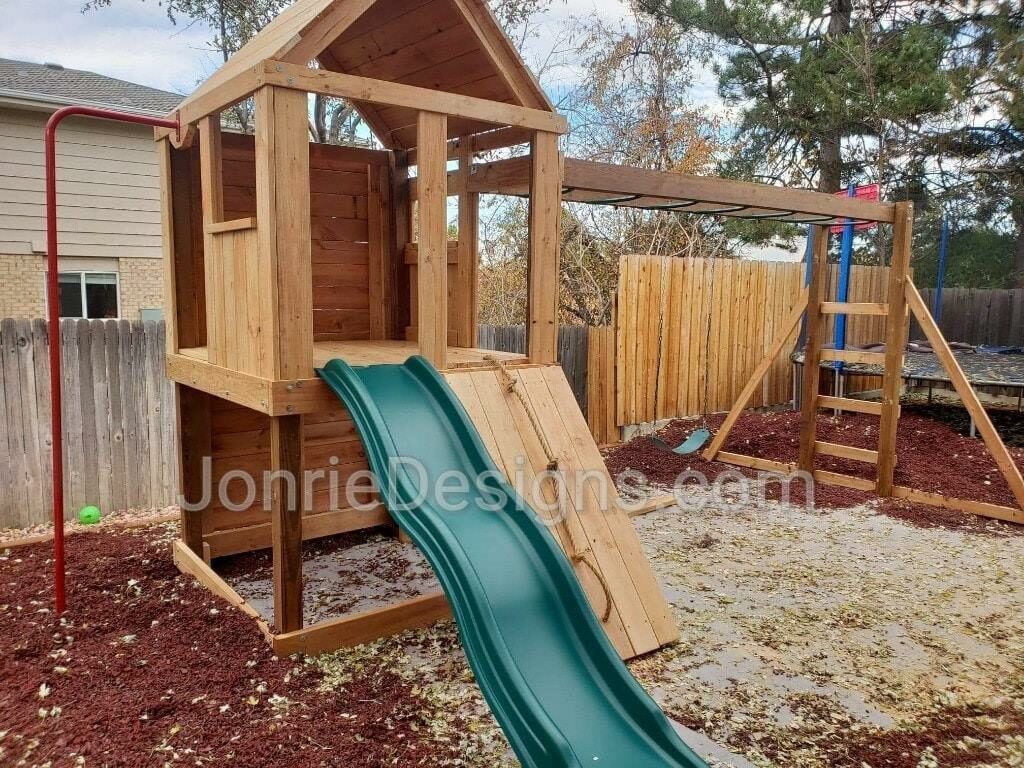 5'x5' Clubhouse with wooden roof, 4' Deck height, 4' Standard slide, Rope wall entry, 8' Climbing wall, Fireman pole, 12' Monkey bars with dual ladders with 3 Standard swings.