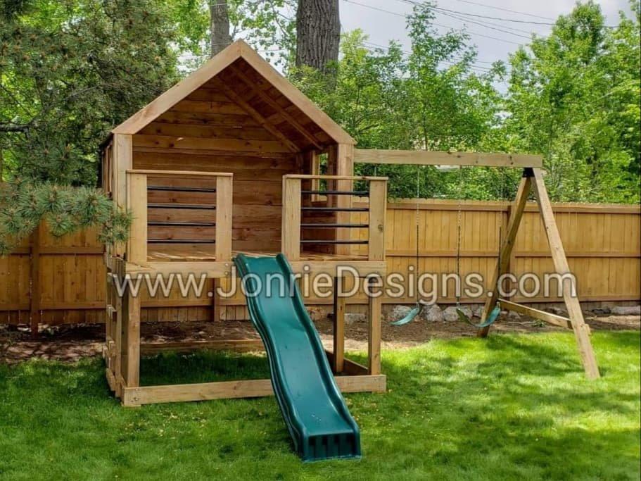 5'x8' Clubhouse with wooden roof, 3'x8' uncovered porch with horizontal rails, Enclosed back wall, enclosed side walls with windows, 4' Standard slide, Ladder entry, 8' Swing beam with 2 Standard swings.