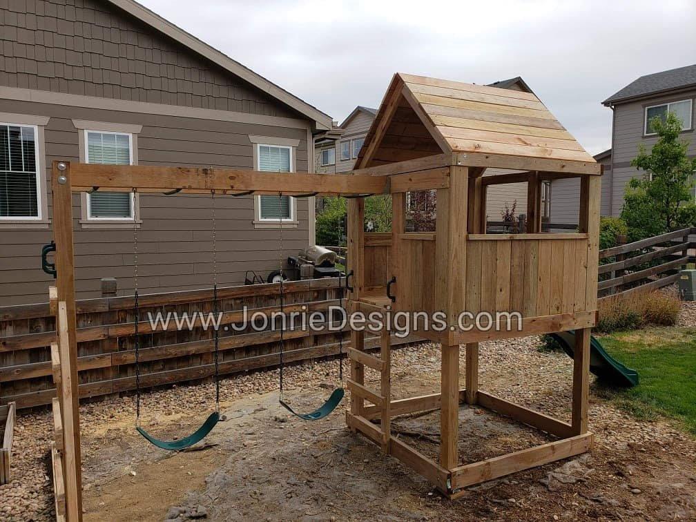 5'x5' Clubhouse with wooden roof, 4' Deck height, 4' Standard slide, 8 Monkey bars with dual ladders & 2 Standard swings.