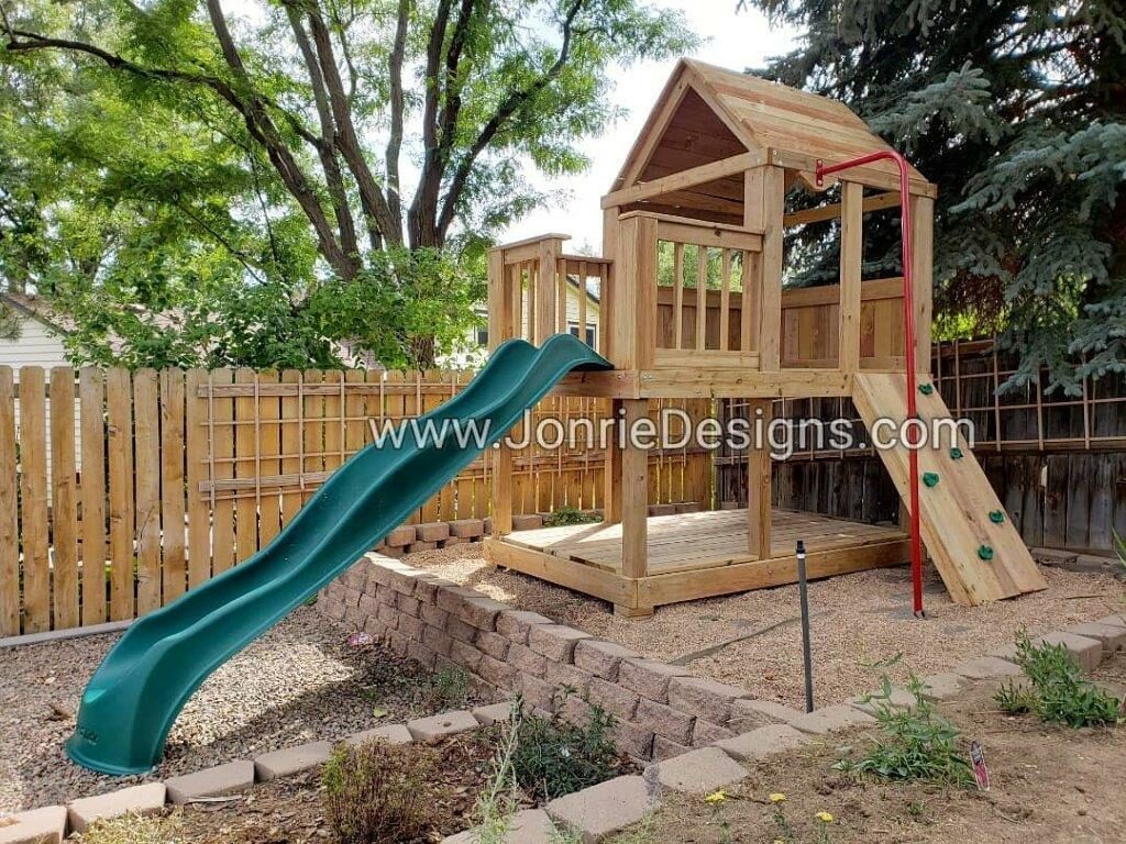 5'x5' Clubhouse with wooden roof, 3'x5' Uncovered porch with baluster rails (total 5'x8' footprint), Floor on bottom, Rock wall entry, Fireman pole & 5' Upgraded slide (needed for tier).